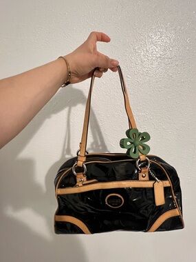 Coach Black Patent Shoulder Bag with Tan Trim and Green Flower Charm